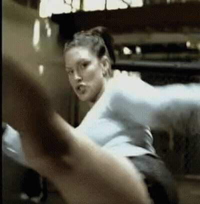 Woman Kicking Leg In Gym GIF