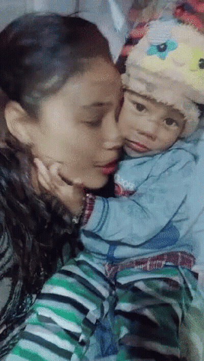 Woman Kissing Baby Wearing Sheep Hat GIF