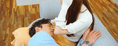 Woman Kissing Man On Couch GIF