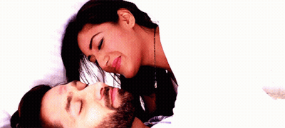 Woman Kissing Man On Forehead In Bed GIF