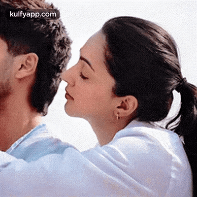 Woman Kissing Man On Nose GIF
