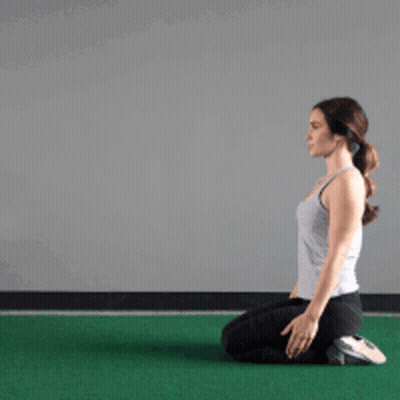 Woman Kneeling On Green Mat GIF