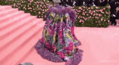 Woman Kneeling On Pink Carpet GIF