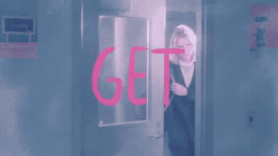 Woman Kneeling With Dog In Bag GIF