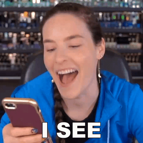 Woman Laughing At Phone I See GIF