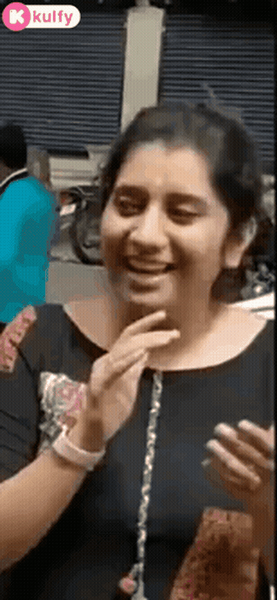 Woman Laughing Covering Mouth On Cell Phone GIF