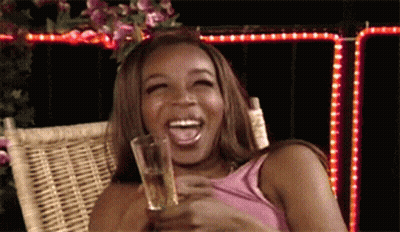 Woman Laughing Holding Beer GIF