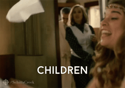 Woman Laughing Holding Children Sign GIF