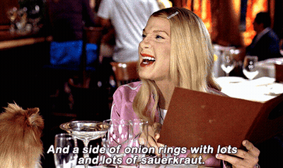 Woman Laughing Holding Menu Saying Side Of Onion Rings With Sauerkraut GIF
