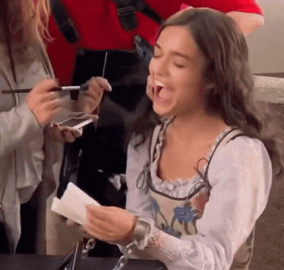 Woman Laughing Holding Paper GIF