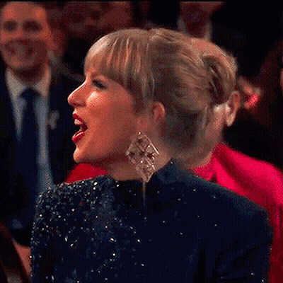 Woman Laughing In Front Of Crowd GIF