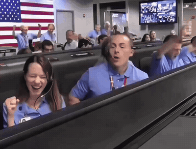 Woman Laughing In Front Of Man With Headsets GIF