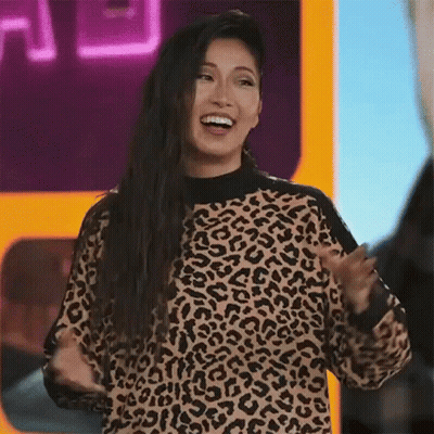 Woman Laughing In Leopard Print Sweater GIF
