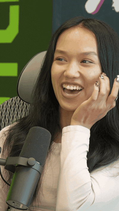 Woman Laughing Into Microphone Green Background GIF