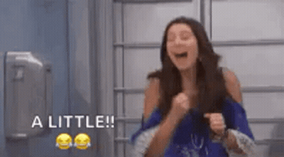 Woman Laughing With Fist In Air Saying A Little GIF