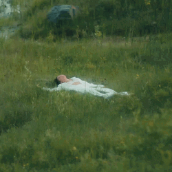 Woman Laydown In The Grass GIF