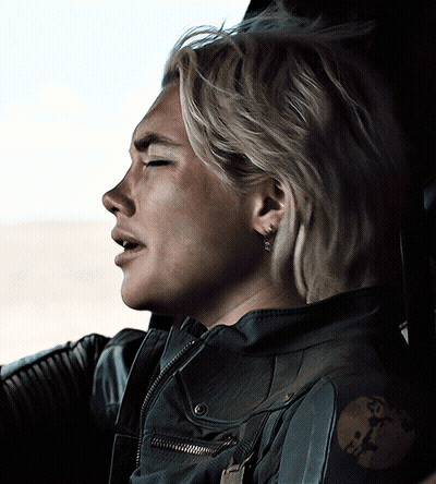 Woman Laying Down With Rifle GIF