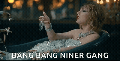 Woman Laying In Bathtub Covered In Ice Holding Necklace GIF