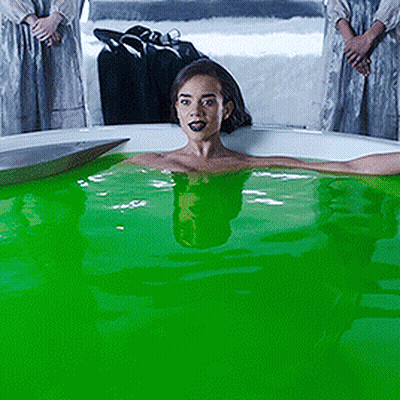 Woman Laying In Bathtub With Green Liquid GIF