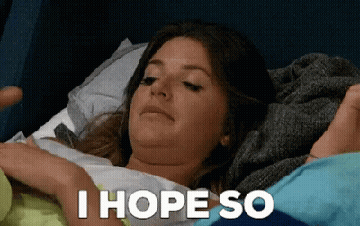 Woman Laying In Bed Saying I Hope So GIF