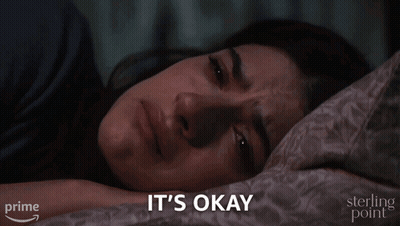 Woman Laying In Bed Saying It's Okay GIF