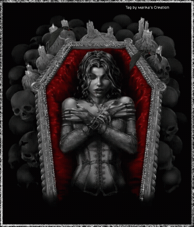 Woman Laying In Coffin Surrounded By Skulls And Candles GIF