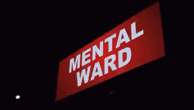 Woman Laying In Hospital Bed With Blue Pillows GIF