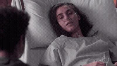 Woman Laying In Hospital Bed With Oxygen Tube GIF