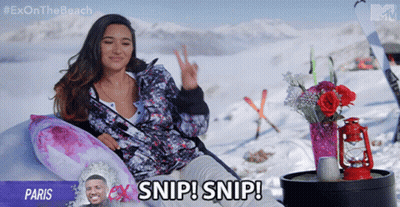 Woman Laying In Snow Saying Snip Snip GIF
