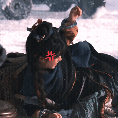 Woman Laying In Snow With Red Symbol On Forehead GIF