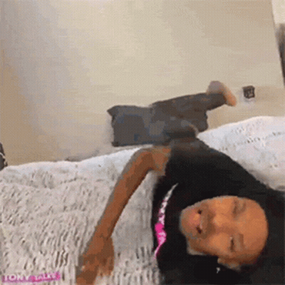 Woman Laying On Bed Eyes Closed GIF