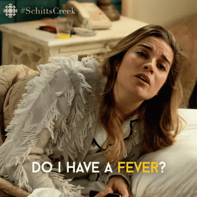 Woman Laying On Bed Saying Do I Have A Fever GIF