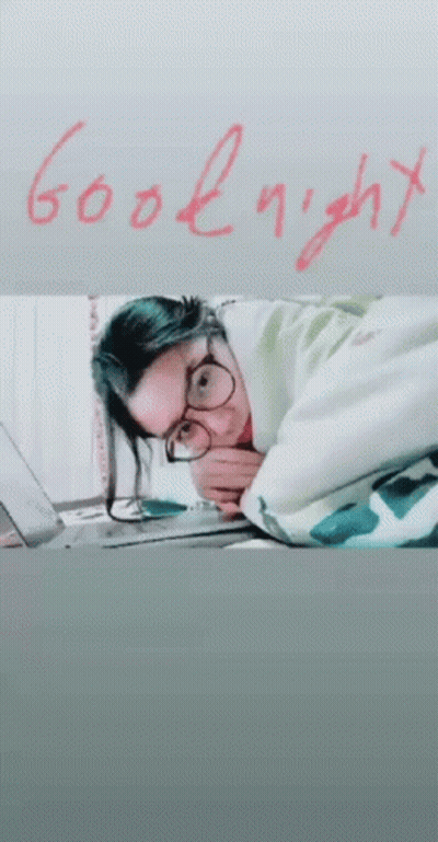 Woman Laying On Bed Saying Goodnight GIF