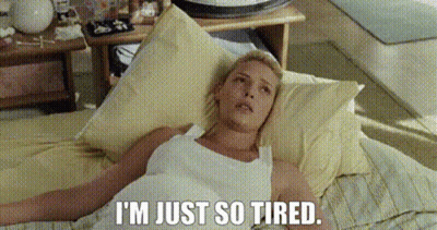 Woman Laying On Bed Saying I'm Just So Tired GIF