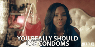 Woman Laying On Bed Saying You Really Should Use Condoms GIF