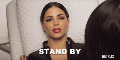 Woman Laying On Bed Stand By Netflix GIF