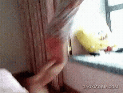 Woman Laying On Bed With Arms Outstretched And Balloon GIF