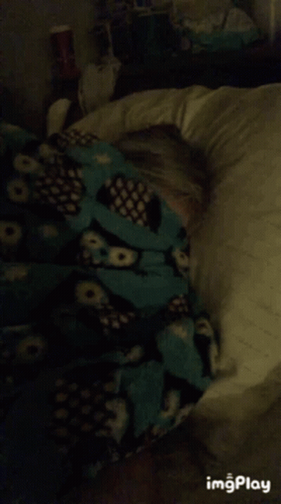 Woman Laying On Bed With Pillow And Blanket On Face GIF