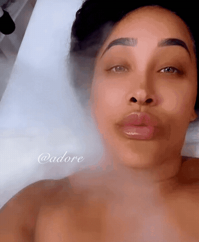 Woman Laying On Bed With Smoke From Face @Adore GIF