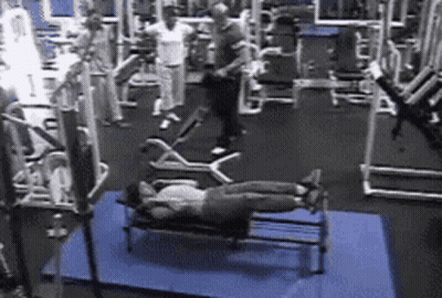 Woman Laying On Bench In Gym GIF