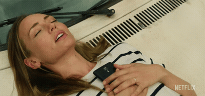Woman Laying On Car Hood With Netflix Logo GIF