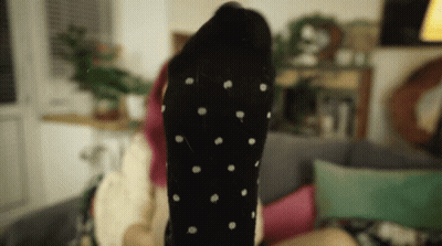 Woman Laying On Couch Feet Up Black Polka Dot Socks GIF