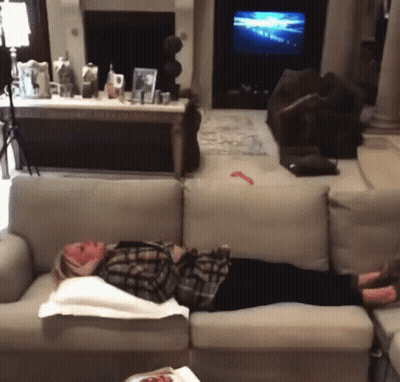Woman Laying On Couch In Living Room GIF