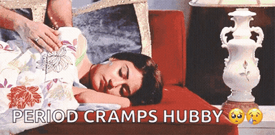 Woman Laying On Couch Saying Period Cramps Hubby GIF