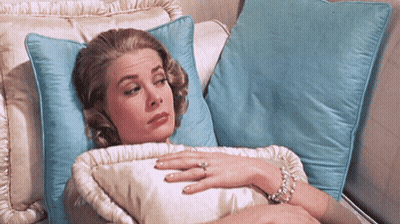 Woman Laying On Couch With Blue Pillow GIF