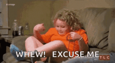 Woman Laying On Couch With Dog GIF