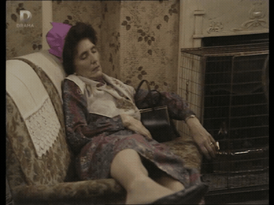 Woman Laying On Couch With Drama On Screen GIF