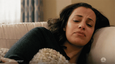 Woman Laying On Couch With NBC Logo GIF