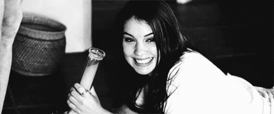 Woman Laying On Floor Holding Bong In Black And White Photo GIF