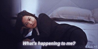 Woman Laying On Floor Saying What's Happening To Me GIF